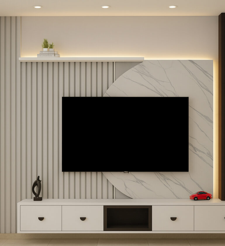Modern TV unit design featuring a wall-mounted flat-screen, white cabinetry with drawers, marble textured panel, vertical fluted paneling, and backlit display shelves.